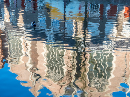 Reflection in water of buildings in main red light district in Amsterdam, Netherlandsの写真素材