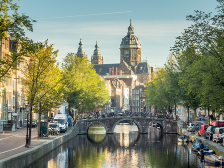 AMSTERDAM - OCTOBER 2: Saint Nichlas church fromt red light district under blue sky in Amsterdam, Netherlands, was taken on October 2, 2015.のeditorial素材