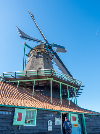 The historic classic windmill named De Kat (The Cat) in Zaan Schans, Netherlandsの写真素材