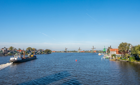 Zaan Schans is popular attractions in Netherlands, has a collection of well-preserved historic windmills and houses, this view from bridge under blue skyの写真素材