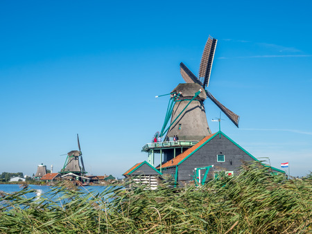 The historic classic windmill named De Kat (The Cat) in Zaan Schans, Netherlandsの写真素材