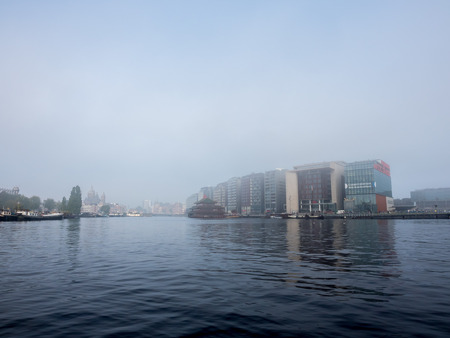 AMSTERDAM - OCTOBER 4: Morning fog blurring atmosphere in Amsterdam, capital city of Netherlands, was taken on October 4, 2015.のeditorial素材