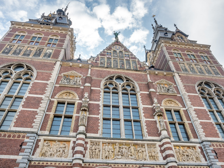 Rijksmuseum building is landmark of Amsterdam under cloudy skyのeditorial素材