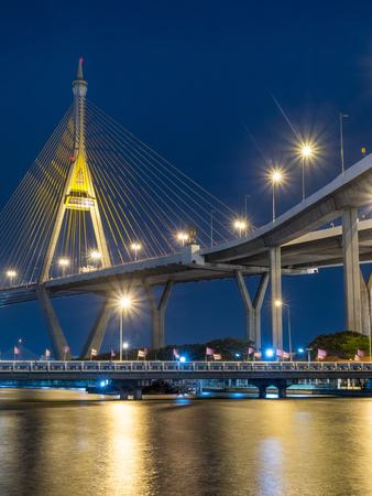 Industrial ring bridges, known as Bhumiphol bridge, cross Chaophraya river in Bangkok under twilight evening sky in Thailand / Thai words mean name of the bridgeのeditorial素材