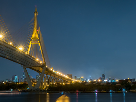 Industrial ring bridges, known as Bhumiphol bridge, cross Chaophraya river in Bangkok under twilight evening sky in Thailand / Thai words mean name of the bridgeのeditorial素材