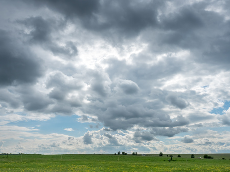 Usual view of rural field and cloudy sky in Englandの写真素材
