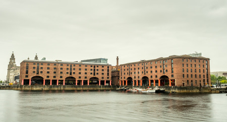LIVERPOOL - MAY 20 : The Albert Dock, the UNESCO World Heritage place, is important historic place in Liverpool city, England, under cloudy white sky, was taken on May 20, 2016.のeditorial素材