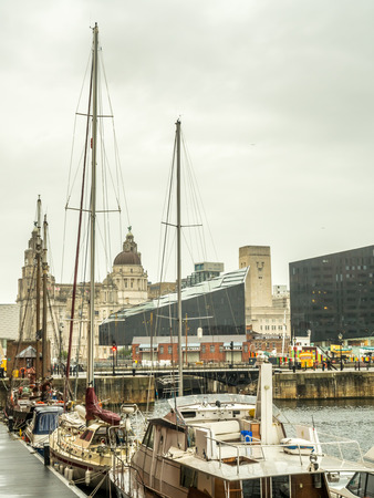 LIVERPOOL - MAY 20 : The Albert Dock, the UNESCO World Heritage place, is important historic place in Liverpool city, England, under cloudy white sky, was taken on May 20, 2016.のeditorial素材