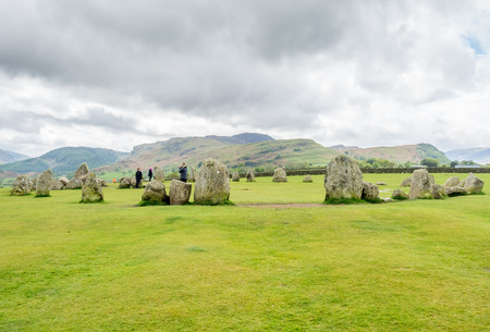 Castlerigg stone circle in Keswick, Cumbria, England, was constructed from prehistoric era, during the Late Neolithic and Early Bronze Ages, under cloudy sky.の写真素材