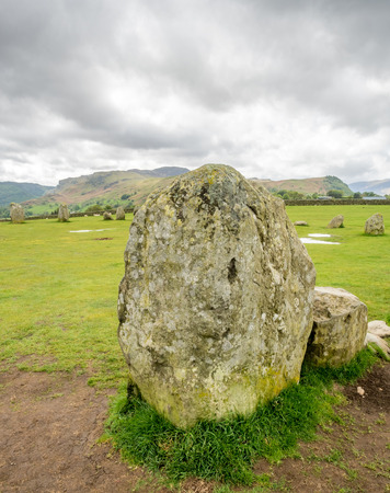 Castlerigg stone circle in Keswick, Cumbria, England, was constructed from prehistoric era, during the Late Neolithic and Early Bronze Ages, under cloudy sky.の写真素材