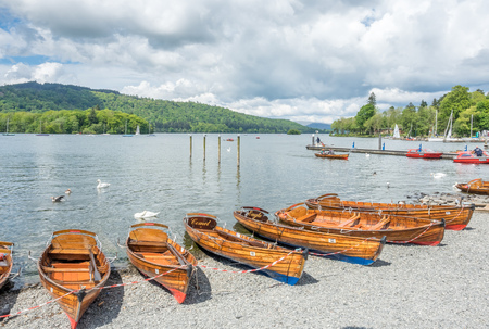 WINDERMERE - MAY 22: Kayak boats on lake coast side of lake in Windermere, England,  was taken on May 22, 2016.のeditorial素材
