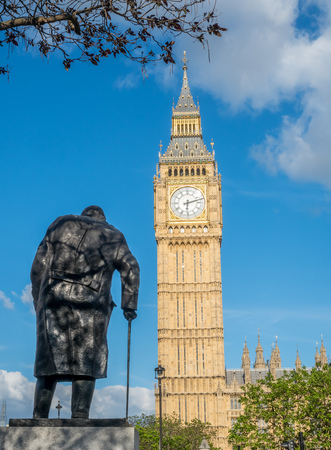 LONDON - MAY 24: Back of Winston Churchill statue with Big Ben on Parliament square garden in London, England, was taken on May 24, 2016.のeditorial素材