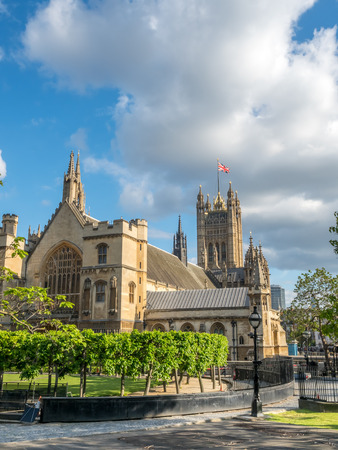 LONDON - MAY 24: Palace of Westminster view from Parliament square garden under cloudy blue sky in London, England, was taken on May 24, 2016.のeditorial素材