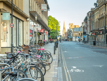 CAMBRIDGE - MAY 23: Traffic along Saint Andrew street, bicycles, cars and pedestrian in Cambridge,...
