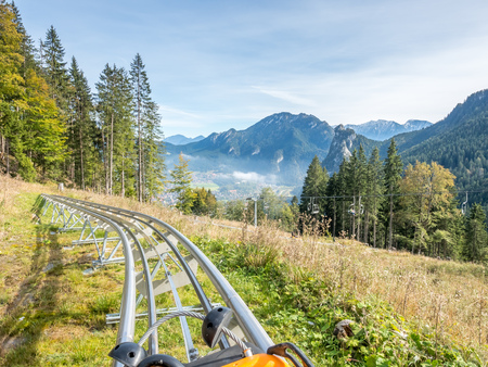 OBERAMMERGAU - OCTOBER 13 : Alpine coaster in Kolbensattel mountain, slide down with gravity, no engine, in Oberammergau, Germany, on October 13, 2016.のeditorial素材