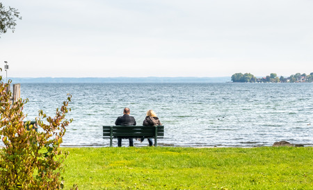 Green trees and grass field in Herrenchiemsee palace park area in Germanyの写真素材