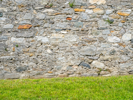 Brick stone wall of Castello di Montebello in Bellinzona city in Switzerland, surrounding with mountain, forests and impressive landscape view, under cloudy blue skyのeditorial素材