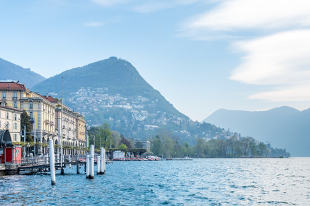 Natural view scene around Lake Lugano, mountain and cloudy blue sky in Switzerlandの写真素材