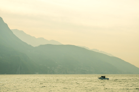 Natural view scene around Lake Lugano, mountain and cloudy blue sky in Switzerlandのeditorial素材