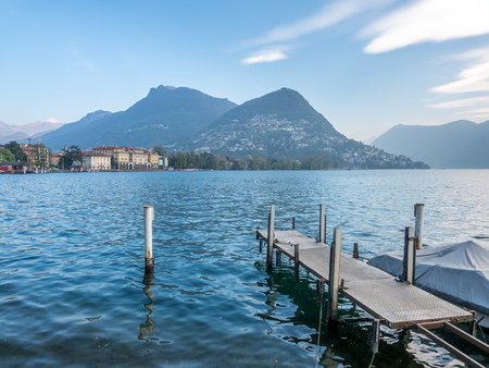 Natural view scene around Lake Lugano, mountain and cloudy blue sky in Switzerlandの写真素材