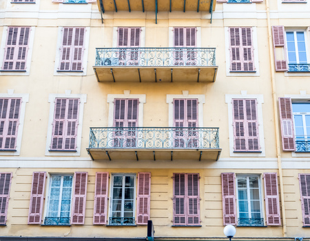 Building in Nice, France, architecture of windows, wall, corridors and doorsの写真素材