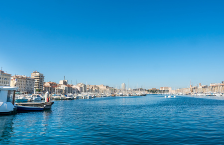 MARSEILLE - APRIL 11 : Scene around old port of Marseille, crowded with yachts docking at port, under clear blue sky in Marseille, France, on April 11, 2017のeditorial素材