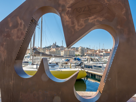 MARSEILLE - APRIL 11 : Art design of M letter window through old port of Marseille view in France, on April 11, 2017.のeditorial素材