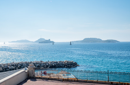 Seascape view at coast side of Mediterranean sea near port in Marseille, France, under clear blue skyの写真素材