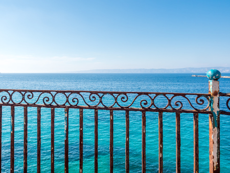 Seascape view at coast side of Mediterranean sea near port in Marseille, France, under clear blue skyの写真素材