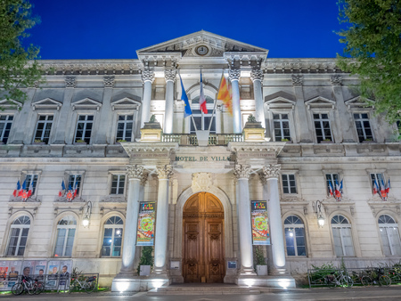 AVIGNON - APRIL 12 : Hotel de Ville, known as City Hall, is landmark in clock square in Avignon, France, under twilight evening sky, on April 12, 2017.のeditorial素材