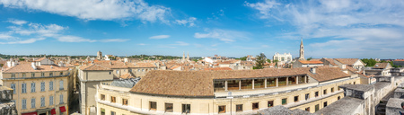 Cityscape view of Nimes in France, under cloudy blue skyのeditorial素材