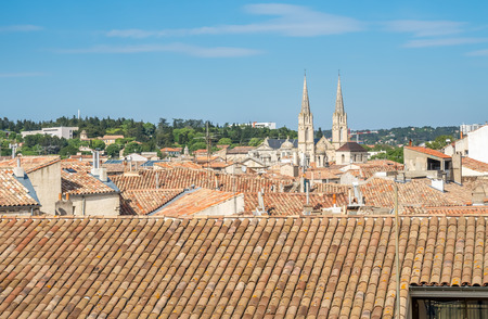 Cityscape view of Nimes in France, under cloudy blue skyの写真素材