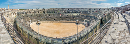 Panoramic wide oval view of interior architecture of Arena of Nimes, ancient Roman amphitheater, in Franceのeditorial素材