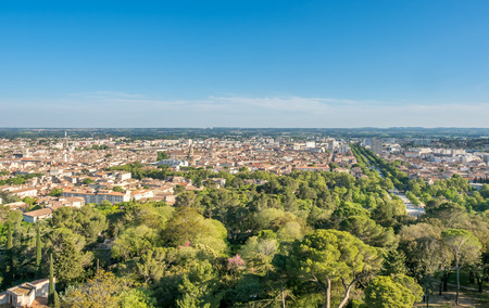 Cityscape view of Nimes, view from ancient Roman tower (La Tour Magne), under cloudy blue sky in Franceの写真素材