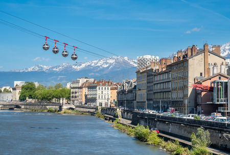 GRENOBLE, FRANCE - APRIL 13 : Grenoble-Bastille cable car, four bubbles on sling, transport to hill and fortress of Bastille cross Isere river in Grenoble, France, was taken on April 13, 2017.のeditorial素材
