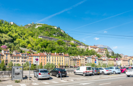 GRENOBLE, FRANCE - APRIL 13 : View of Bastille hill and fortress in Grenoble, France, under blue sky, on April 13, 2017.のeditorial素材