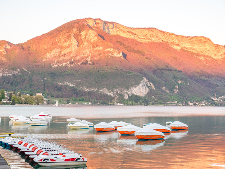 ANNECY, FRANCE - APRIL 13 : Boats dock at pier in lake in Annecy, France, on April 13, 2017.のeditorial素材