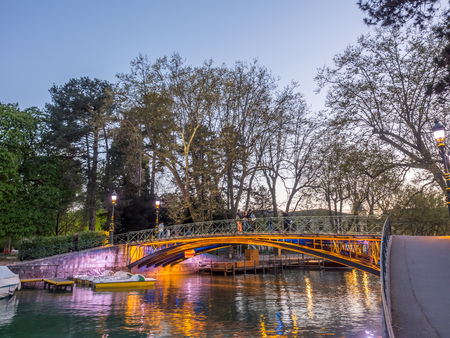 ANNECY, FRANCE - APRIL 13 : Pont d'Amour, known as Lovers' bridge, landmark at shore of lake in Annecy, France, in twilight evening, on April 13, 2017.のeditorial素材