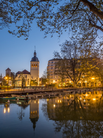 ANNECY, FRANCE - APRIL 13 : Tower and building of church of St.Maurice, near canal in Annecy, France, under evening twilight sky on April 13, 2017.のeditorial素材