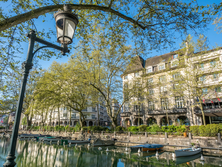ANNECY, FRANCE - APRIL 14 : Street light lamp along canal in Annecy, France, under clear blue sky in outdoor park in April 14, 2017.のeditorial素材