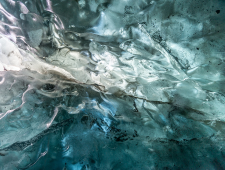 Ice cave located beneath glacier among ice mountain in Iceland, it is mesmerizing landmark.