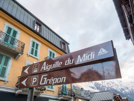 CHAMONIX-MONT-BLANC, FRANCE - APRIL 15 : Traffic signs to Aiguille du Midi, cable car to Mont Blanc peak, in Chamonix Mont Blanc town in France, on April 15, 2017.のeditorial素材