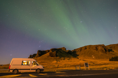Aurora Borealis, known as Northern lights, is amazing green color light over night sky in high lattitude region, natural phenomenon in Icelandの写真素材