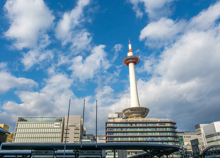 KYOTO, JAPAN - NOVEMBER 24 : Kyoto tower at front of Kyoto train staion with buildings in Kyoto city, Japan, was taken on November 24, 2017.のeditorial素材