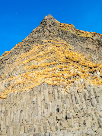 Strange basalt rock mountain near Reynisfjara black sand beach in Vik town, one of the landmark of Icelandの写真素材
