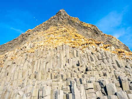 Strange basalt rock mountain near Reynisfjara black sand beach in Vik town, one of the landmark of...