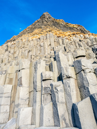 Strange basalt rock mountain near Reynisfjara black sand beach in Vik town, one of the landmark of Icelandの写真素材