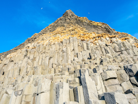Strange basalt rock mountain near Reynisfjara black sand beach in Vik town, one of the landmark of Icelandの写真素材