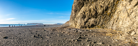 Panoramic view of basalt rock mountain and Reynisfjara black sand beach in Vik town, landmark of Icelandの写真素材