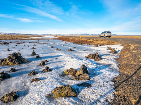 LaufskÃ¡lavarÃ°a, lava ridge between river, surrounded with stone cairns, just side of golden ring road in Iceland. In winter season, field becomes ice and snow.の写真素材